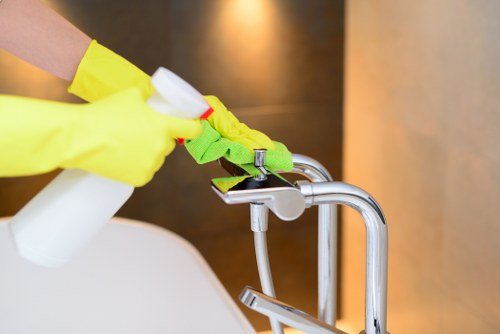 Professional cleaner working in a Westkensington office space