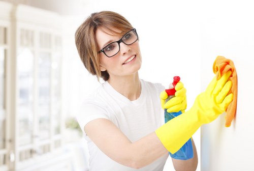 Cleaner applying safe practices during a routine cleaning task
